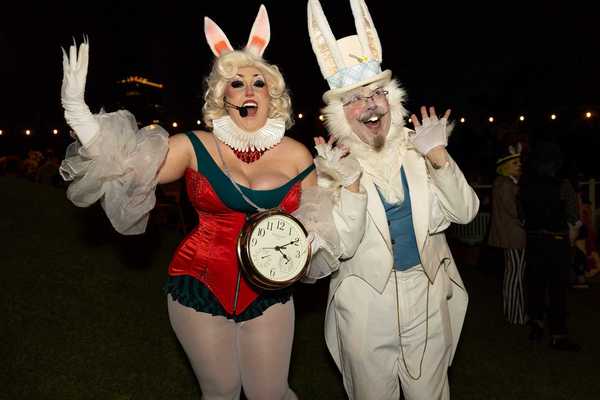 two people dressed like the rabbit from alice in wonderland