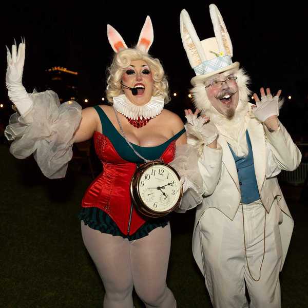 two people dressed like the rabbit from alice in wonderland