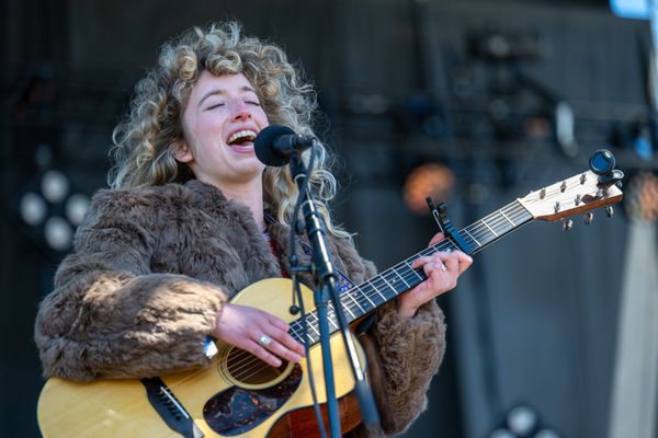 woman guitar player live music concert